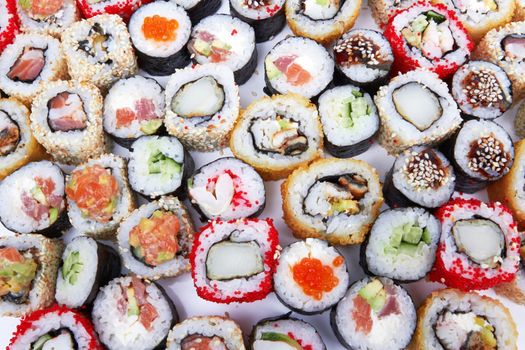 different types of sushi as background 