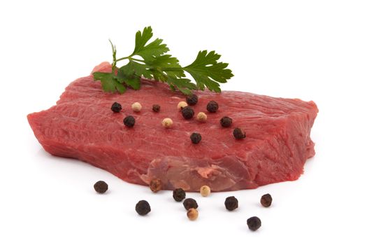 raw beef with spices on white background 