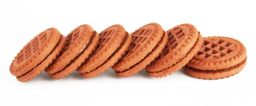 Stack of chocolate cream oreo cookies over white.