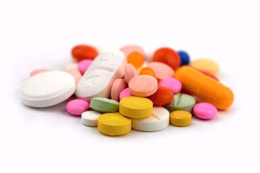 vitamins, pills and tablets on a white background