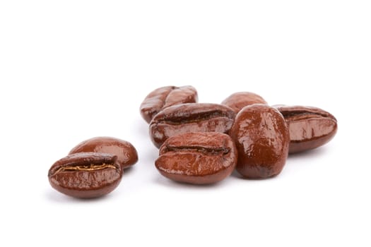 Brown coffee beans on a white background