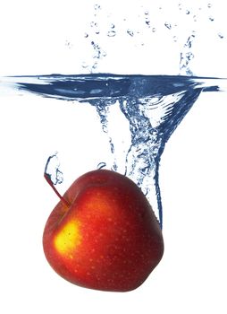 Apple falls deeply under water with a big splash.
