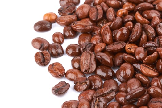 Brown coffee beans on a white background