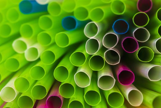 Abstract colorful background. Background from cocktail tubes close up. Soft focus. Cocktail tubes of different colors close up.Close-up of straw tubes.