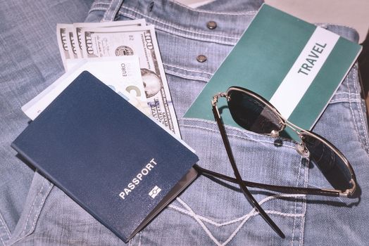 Set of trip stuff on wooden background.Travel set of passport money and tickets for travel on vacation.