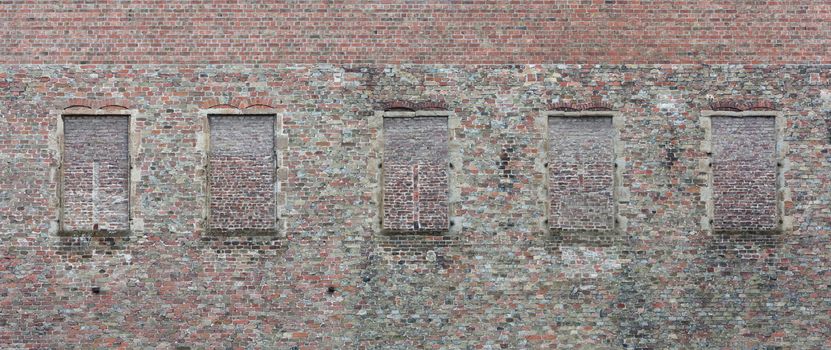 Brick wall with windows bricked over, Belgium