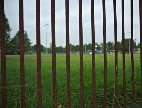 Entrance gate bars to a football field