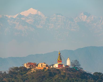 Swayambhunath stupa also called Monkey Temple in Kathmandu, Nepal. In the background the Langtang range, a subrange of the Himalayas.