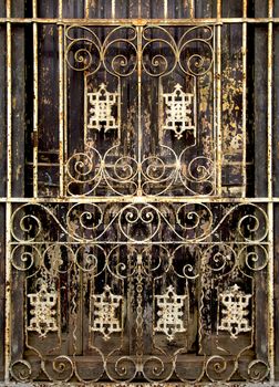Beautiful forged grille on the wooden  door in Old Havana, Cuba