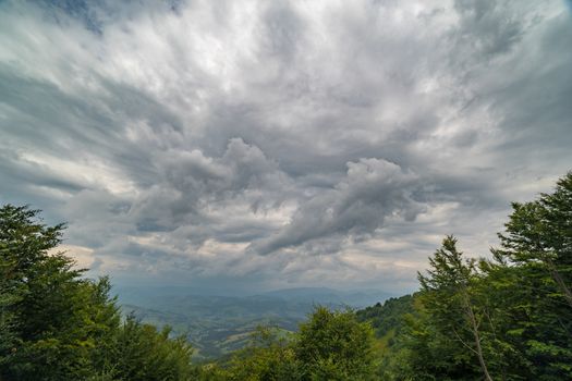 Rain clouds above Carpathians. Panorama of Borzhava ridge of the Ukrainian Carpathian Mountains