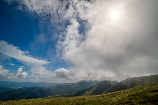 Landscape of Borzhava ridge of the Ukrainian Carpathian Mountains. Clouds above Carpathians