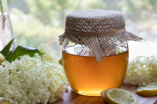 Preparation of a natural elder flower syrup from fresh elder flowers, honey, and lemon