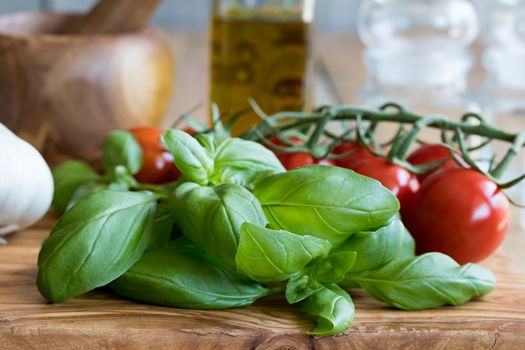 Fresh basil and cherry tomatoes - ingredients for Italian cuisine