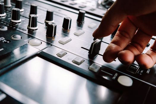 Dj playing music at mixer