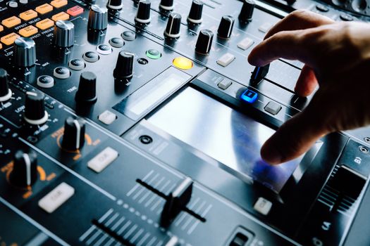 Dj playing music at mixer