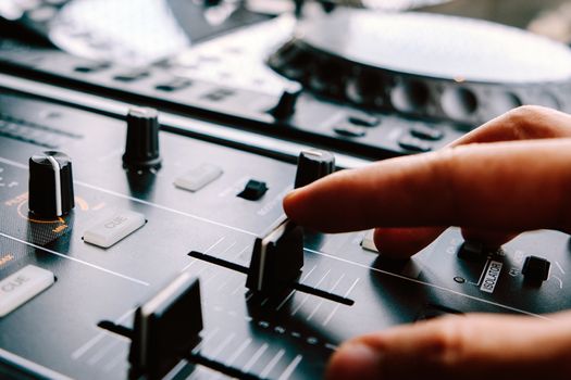 Dj playing music at mixer
