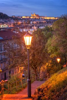 Vyshehrad park at night, beautiful view to the historical bridges and Prague castle, vertical image, Czech Republic, Europe