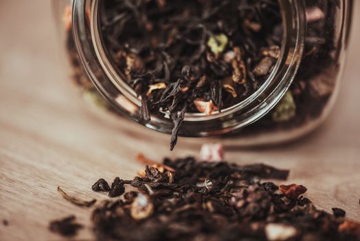 jar with scattering black fruit tea