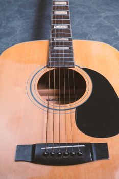 acoustic guitar on blue marble background,music concept.