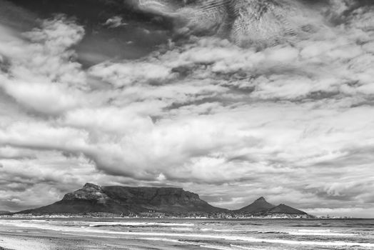 The Cape Town Central Business District and Table Mountain as seen across Table Bay from Dolphin Beach. Monochrome