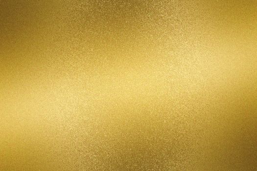 Glowing gold metallic plate surface, abstract background
