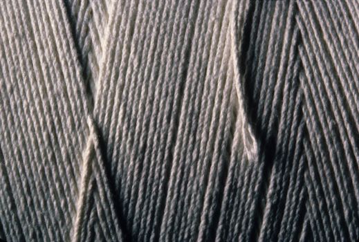 Close-up of wound up white cotton string