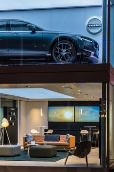 Volvo showroom with car on the upper and stylish furniture and the lower floor