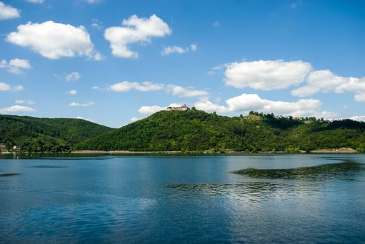 Castle on top of hill at Edersee Germany sea water sky