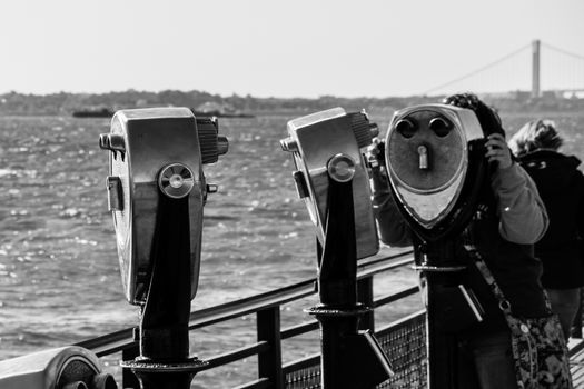Binocular spyglass field glass on Liberty Island New York black and white