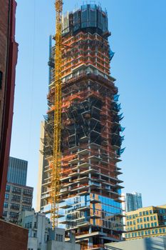 Construction sight in downtown New York yellow construction crane skyscraper