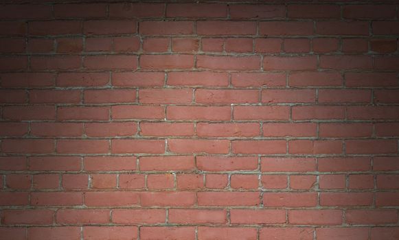 Seamless red brick wall background texture lit dramatically from above