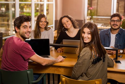 Groups of friends studying together on the bibliotech