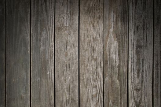 Weathered wooden planking background texture lit from above