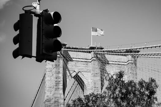 American flag on Brooklyn bridge seen from Brooklyns streets