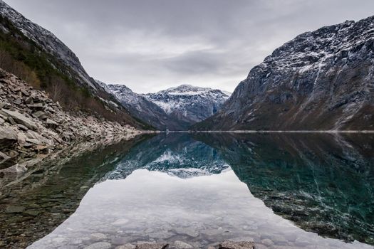 Trolltunga lake mountain reflection Norway