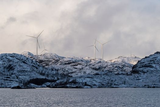 Winter turbines on mountains with snow