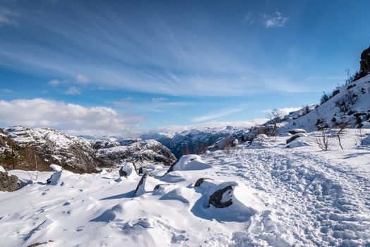 Deep snow hiking Preikestolen sunny