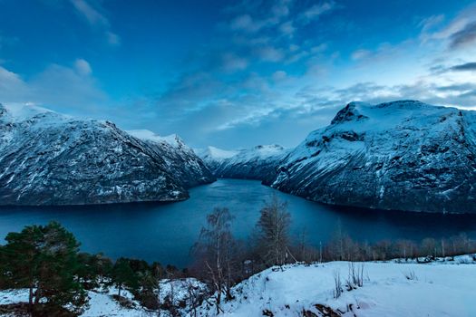 Geiranger fjord in winter snow covered