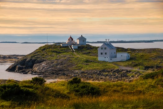 Lighthouse at coast Norway sunset landscape