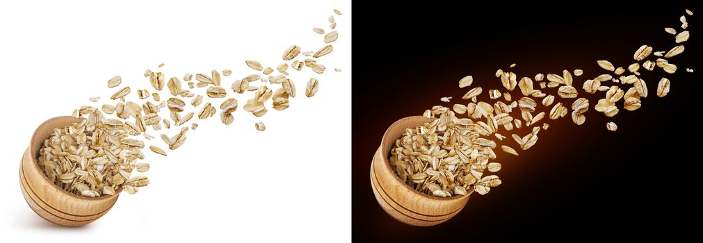 Oat flakes flying out of wooden bowl isolated on white and black background. Falling oats