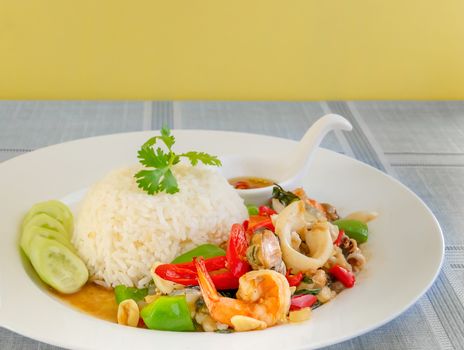 Mixed Seafood fried with chili and vegetables Served with steamed rice on dish