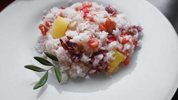 Rice with with shrimp and pineapple, thai or china food on white dish