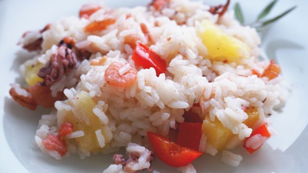 Rice with with shrimp and pineapple, thai or china food on white dish