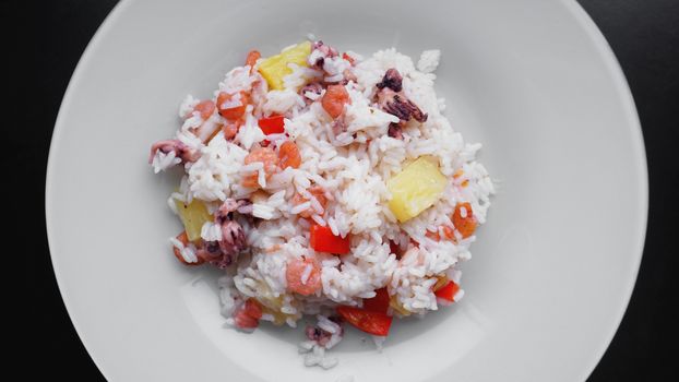 Rice with with shrimp and pineapple, thai or china food on white dish