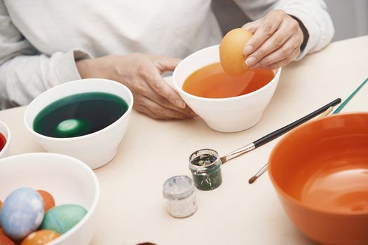 Woman preparing Easter eggs