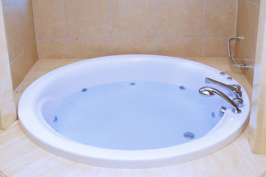 Modern bathtub full of water