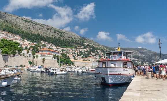 Dubrovnik, Croatia - 07. 13. 2018. Pleasure boat in the old port of Dubrovnik, Croatia, on a sunny summer day.