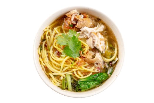 Asian soup noodles and chicken in bowl. Top view flat lay isolated on white background.