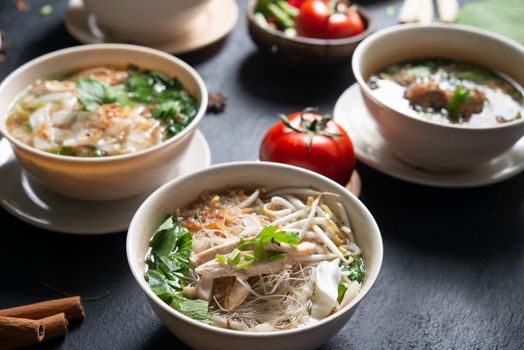 Various Southeast Asian dishes, noodles and soup.