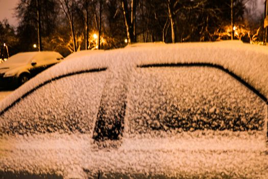 Cityscape - parked cars covered with snow